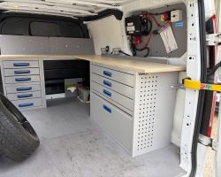 VK Ref: 2121 Locksmiths Workbench L Shape Racking fitted in a SWB Transit Custom.